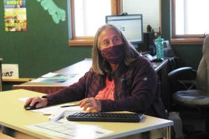 Linda Rourke navigates the various web pages needed for her Alaska History class, where she is a longterm sub, on Monday, Aug. 24, 2020 at Homer High School in Homer, Alaska. (Photo by Megan Pacer/Homer News)