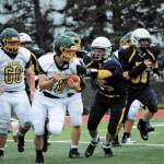 Mariner player Dodge Petrosius, right, goes for the tackle as Seahawks No. 10 tries to outrun him in a Saturday, Aug. 29, 2020 football game in Homer, Alaska. (Photo by Michael Armstrong/Homer News)