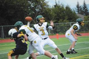 Seahawks quarterback No. 3 looks for a place to throw during a Saturday, Aug. 29, 2020 football game against Homer High School in Homer, Alaska. (Photo by Michael Armstrong/Homer News)