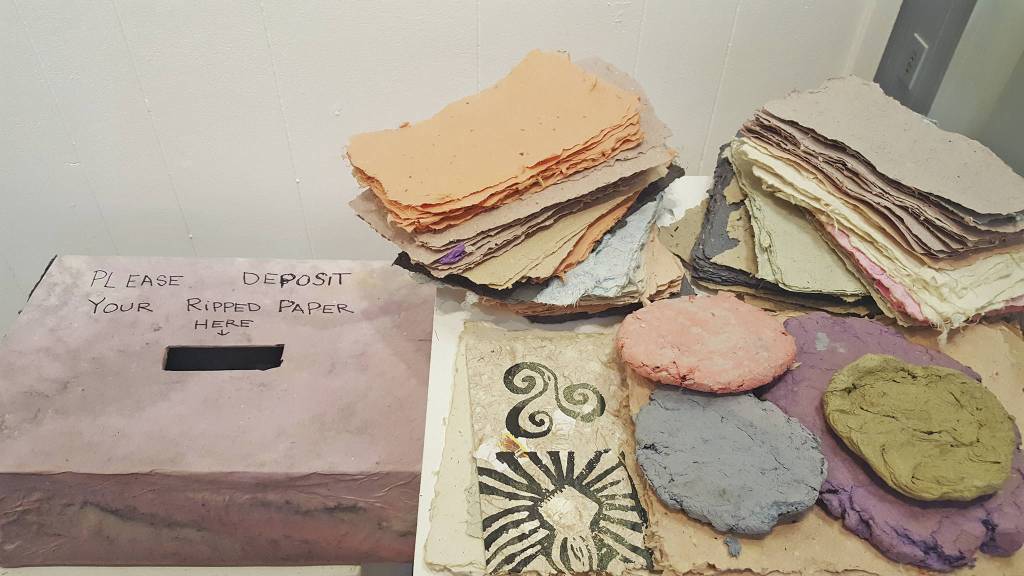 Artists Desiree Hagen and Kayla Bloom invited visitors to write on pieces of paper at the Homer Council on the Arts in Homer, and then deposit them in a box to be used in an art installation on Friday, Sept. 4. (Photo courtesy Homer Council on the Arts)