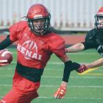Photo by Jeff Helminiak / Peninsula Clarion                                Luke Armstrong and James Sparks practice punt return and coverage Monday, Aug. 31, at Ed Hollier Field at Kenai Central High School in Kenai.