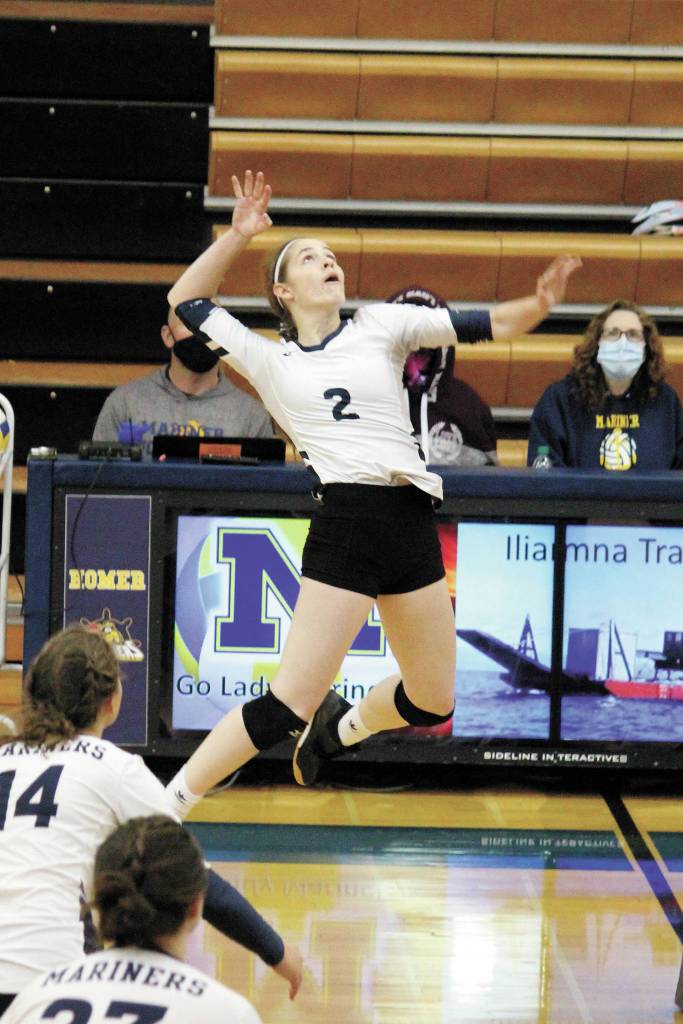 Homers Laura Inama jumps to spike the ball in a volleyball game against Seward High School on Friday, Sept. 4, 2020 at Homer High School in Homer, Alaska. (Photo by Megan Pacer/Homer News)