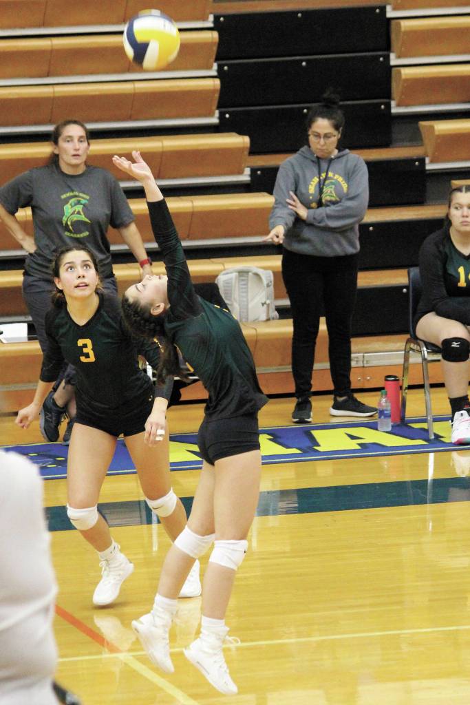 Sewards Hannah Schilling sets the ball to teammate Gaia Casagranda (No. 3) during a Friday, Sept. 4, 2020 volleyball game against Homer High School in the Alice Witte Gymnasium in Homer, Alaska. (Photo by Megan Pacer/Homer News)