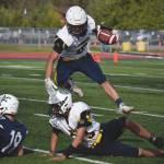 Homers Sly Gaona jumps over teammate Eddie Robinett on Saturday, Sept. 5, 2020, at Justin Maile Field at Soldotna High School in Soldotna, Alaska. (Photo by Jeff Helminiak/Peninsula Clarion)