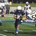 Homers Josh Manwiller and Dodge Petrosius converge on Soldotnas Dennis Taylor on Saturday, Sept. 5, 2020, at Justin Maile Field at Soldotna High School in Soldotna, Alaska. (Photo by Jeff Helminiak/Peninsula Clarion)