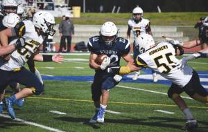 Homers Josh Manwiller and Dodge Petrosius converge on Soldotnas Dennis Taylor on Saturday, Sept. 5, 2020, at Justin Maile Field at Soldotna High School in Soldotna, Alaska. (Photo by Jeff Helminiak/Peninsula Clarion)