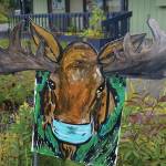 A painting of a masked moose by Julianne Tomich is in front of the Homer Council on the Arts on Thursday, Sept. 3, 2020, in Homer, Alaska. (Photo by Michael Armstrong/Homer News)