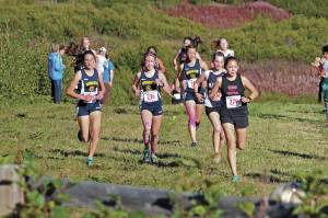 Kenais Emilee Wilson leads a group of runners up a hill during the varsity girls 5 kilometer race Friday, Sept. 11, 2020 at the Lookout Mountain Trails near Homer, Alaska. (Photo by Megan Pacer/Homer News)