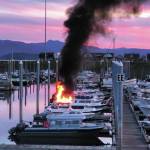 Flames and smoke rise from a 32-foot fiberglass boat docked in the Homer Harbor on the evening of Friday, Sept. 11, 2020 in Homer, Alaska. No one was harmed and the Homer Volunteer Fire Department put out the fire. (Photo by John Pratt)