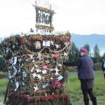 As Peggy Paver right, watches, Mavis Muller, left, places a note inReimagine, the 17th annual Burning Basket, in a field on Sunday, Sept. 13, 2020, near Homer, Alaska. Artist and coordinator Muller intended to broadcast live on Facebook and YouTube the burning of the basket, but because of technical difficulties that didnt happen. Burning Basket teaches how to let go of expectations and accept the present moment, Muller wrote in a text message. Technology is fickle. The basket, however, did exactly what it promised to do. It helod our collective burderns, our memorials, our joys, sadness, fear, and dispersed all of our good intentions in a plume of smoke, sparks and flames. (Photo by Michael Armstrong/Homer News)
