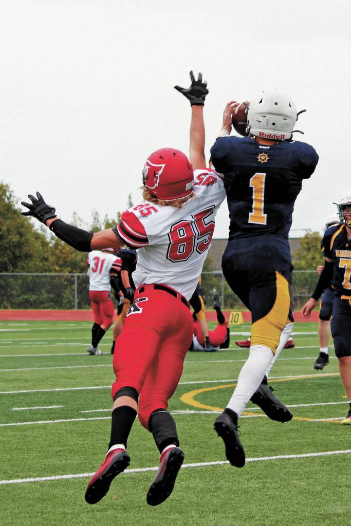 Homers Cade Hrenchir intercepts a ball during a Saturday, Sept. 19, 2020 football game against the Kenai Kardinals at Homer High School in Homer, Alaska. (Photo by Megan Pacer/Homer News)
