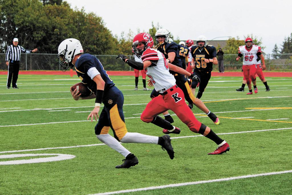 Homers Cade Hrenchir takes off after intercepting a Kenai pass during a Saturday, Sept. 19, 2020 football game against the Kenai Kardinals at Homer High School in Homer, Alaska. (Photo by Megan Pacer/Homer News)