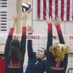 Homers Katlyn Vogl attacks Kenai Centrals Abby Every and Emma Beck on Friday, Sept. 18, 2020, at Kenai Central High School in Kenai, Alaska. (Photo by Jeff Helminiak/Peninsula Clarion)