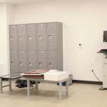 Lockers and a fingerprinting machine sit in the intake area for inmates in the jail portion of the new Homer Police Station, seen here on Thursday, Sept. 24, 2020 in Homer, Alaska. Unlike in the previous station, the cell block area is completely separated from the administrative side of the building. (Photo by Megan Pacer/Homer News)