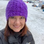 This March 13, 2020, photo, provided by Dr. Jodie Guest, an infectious disease epidemiologist at Emory University in Atlanta, shows Guest as an Iditarod Trail Sled Dog Race volunteer at a checkpoint in Unalakleet, Alaska. Guest will help advise the Iditarod as it plans to run the 2021 race amid the coronavirus pandemic. (Courtesy Photo / Dr. Jodie Guest)