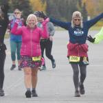Ninilchiks Elise Spofford supports Anchorages Julie Jokinen, Anchorages Sara Peebles and Soldotnas Debra Hart in the half marathon at the Kenai River Marathon in Kenai, Alaska, on Saturday, Sept. 27, 2020. (Photo by Jeff Helminiak/Peninsula Clarion)