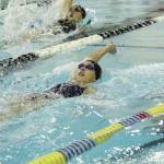 Homers Delta Fabich and Madison Story (upper left) compete in the girls 100 yard backstroke Friday, Oct. 2, 2020 during a dual meet against Seward High School at the Kate Kuhns Aquatic Center in Homer, Alaska. (Photo by Megan Pacer/Homer News)