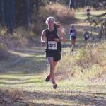 Kenai Central's Jayna Boonstra runs to victory at the Region III/Southern Division meet Saturday, Oct. 3, 2020, at Tsalteshi Trails near Soldotna, Alaska. (Photo by Jeff Helminiak/Peninsula Clarion)
