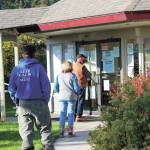 A short line forms outside of Homer City Hall as people wait to vote in the regular municipal election on Tuesday, Oct. 6, 2020 in Homer, Alaska. (Photo by Megan Pacer/Homer News)