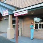 Registered Nurse Annie Garay puts the finishing touches on South Peninsula Hospitals new COVID-19 testing site, located at the lower level of the hospitals specialty clinic at 4201 Bartlett Street, on Tuesday, Oct. 6, 2020 in Homer, Alaska. Its a self-swab site where people register at one window, and collect a swab kit from a nurse at another window. (Photo by Megan Pacer/Homer News)