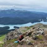 The author surveys part of Kachemak Bay State Park from the top of Grace Ridge on July 23, 2020 across Kachemak Bay from Homer, Alaska. (Photo by Lauren Jerew)