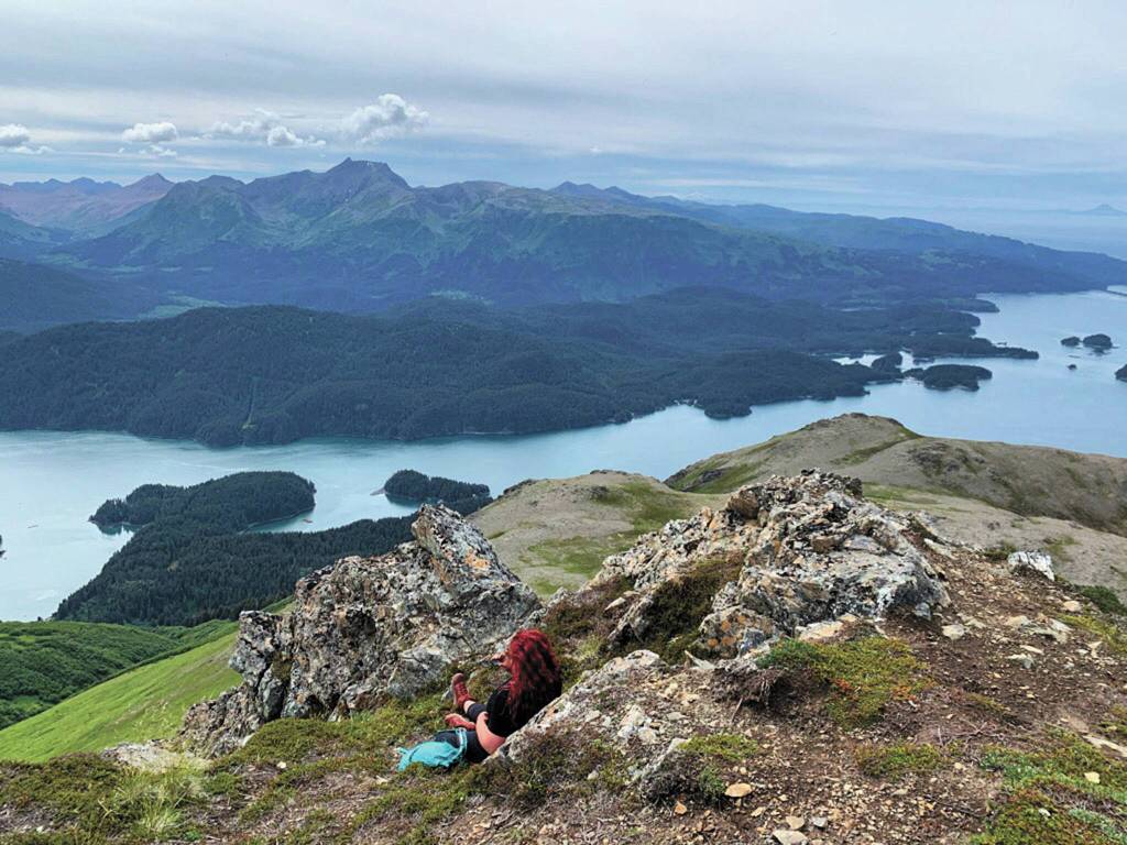 The author surveys part of Kachemak Bay State Park from the top of Grace Ridge on July 23, 2020 across Kachemak Bay from Homer, Alaska. (Photo by Lauren Jerew)