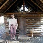 Photo provided by Kenai National Wildlife RefugeAndrew Berg outside his ҈omesteadӠcabin, which stood originally on Tustumena Lake and now stands at the headquarters of Kenai National Wildlife Refuge.