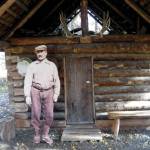Andrew Berg outside his ҈omesteadӠcabin, which stood originally on Tustumena Lake and now stands at the headquarters of Kenai National Wildlife Refuge. (Photo provided by Kenai National Wildlife Refuge)