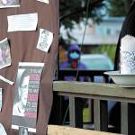 A banner and candles were part of a rally held to commemorate Ruth Bader Ginsburg and protest swift action to replace her on the Supreme Court held Saturday, Oct. 17, 2020 at WKFL Park in Homer, Alaska. (Photo by Megan Pacer/Homer News)
