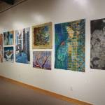 Some of the 45 art quilts featured in Shifting Tides: Cloth in Convergence, on exhibit from Oct. 9 to Nov. 28, 2020, at the Pratt Museum in Homer, Alaska. (Photo by Michael Armstrong/Homer News)