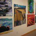 Some of the 45 art quilts featured in "Shifting Tides: Cloth in Convergence," on exhibit from Oct. 9 to Nov. 28, 2020, at the Pratt Museum in Homer, Alaska. (Photo by Michael Armstrong/Homer News)