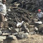 Photo provided by Kenai National Wildlife Refuge 
Kasey Renfro and Seth Payment show off their tier rock wall on Skyline Trail.