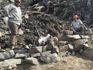 Photo provided by Kenai National Wildlife Refuge 
Kasey Renfro and Seth Payment show off their tier rock wall on Skyline Trail.