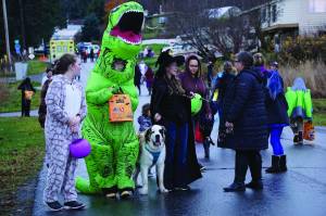 Halloween trick-or-treaters walk down Bayview Avenue, on Oct. 31, 2019, in Homer, Alaska. Bayview Avenue and Mountainview Avenue were one-way for the night to minimize traffic. (Photo by Michael Armstrong/Homer News)