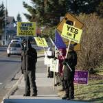 Supporters of Alaska Ballot Measure 1 wave signs urging a yes vote on Tuesday, Nov. 3, 2020, on Pioneer Avenue in Homer, Alaska. Ballot Measure 1 seeks to change the tax structure for some Alaska oil and gas production. (Photo by Michael Armstrong/Homer News)