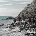 Veterans who participated in the 23rd Veteran trip to Homer, Alaska, scramble around rocks on an incoming tide on a Kachemak Bay beach during their trip Oct. 11 to 16, 2020, near Homer, Alaska. (Photo by Anthony Droz/Outdoor Initiative)