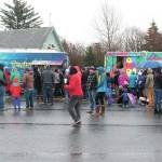 People wait in line to eat from three different visiting food trucks on Sunday, Nov. 8 at the Homer Chamber of Commerce & Visitor Center in Homer. Five food trucks came to town as part of the Food Network show The Great Food Truck Race. (Photo by Megan Pacer/Homer News)