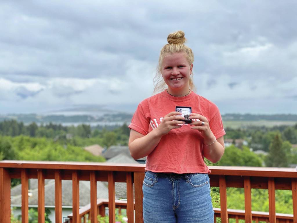 Young Woman of Distinction Daisy Kettle holds her award from South Peninsula Haven House in this photo taken July 25, 2020, in Homer, Alaska. (Photo courtesy South Peninsula Haven House)
