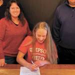 Jessica Sonnen signs her National Letter of Intent to play soccer at Simpson University. (Photo courtesy Karin Sonnen)
