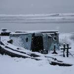 Snow falls on an old boat on Sunday, Nov. 29, 2020, on the Homer Spit in Homer, Alaska. (Photo by Michael Armstrong/Homer News).