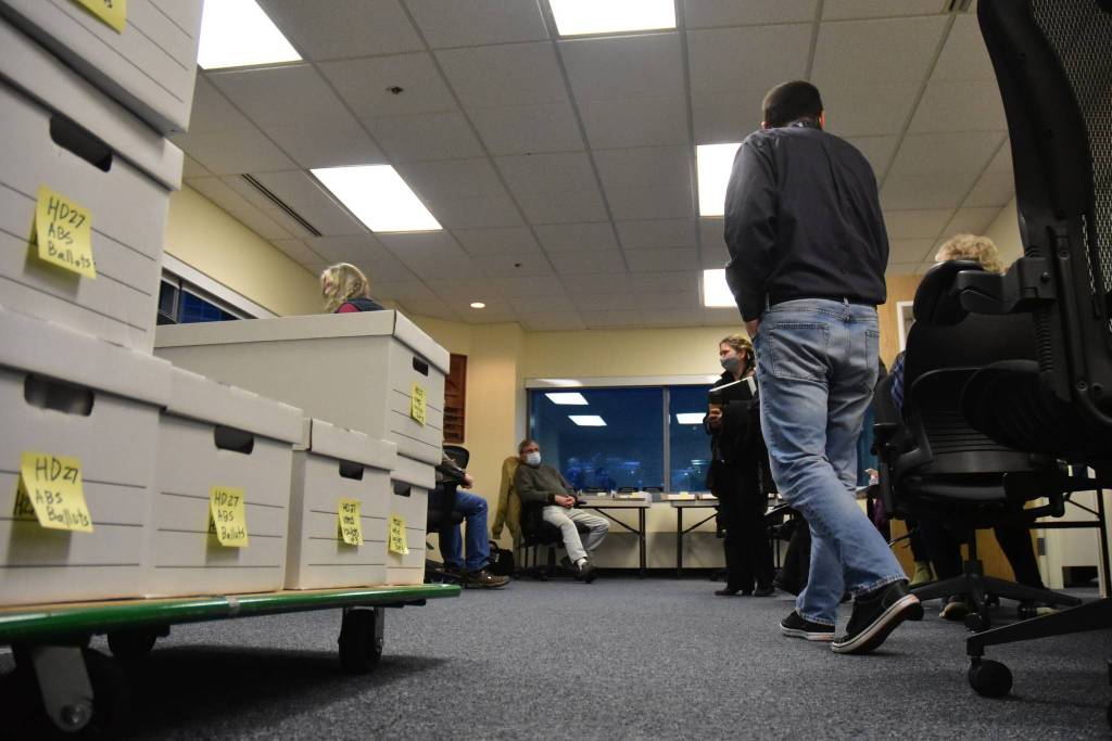Divisions of Elections staff and members of the State Review Board get ready to recount ballots from Anchorages House District 27 at the DOE directors office in Juneau on Friday, Dec. 4, 2020. (Peter Segall / Juneau Empire)