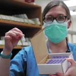 South Peninsula Pharmacist Jill Kort holds up a vial of the Pfizer vaccine for COVID-19 shortly after it arrived at the hospital on Wednesday, Dec. 16, 2020 in Homer, Alaska. (Photo by Megan Pacer/Homer News)
