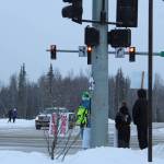 Children are seen protesting remote learning at the intersection of Kenai Spur Hwy. and Sterling Hwy. on Tuesday, Dec. 15, 2020 in Soldotna, Alaska. (Photo by Ashlyn OHara/Peninsula Clarion)