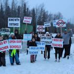 Protestors are seen at the intersection of Kenai Spur Hwy. and Sterling Hwy. on Tuesday, Dec. 15, 2020 in Soldotna, Alaska. (Photo by Ashlyn OHara/Peninsula Clarion)