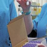 South Peninsula Pharmacist Jill Kort holds up a vial of the Pfizer vaccine for COVID-19 shortly after it arrived at the hospital on Wednesday, Dec. 16, 2020 in Homer, Alaska. (Photo by Megan Pacer/Homer News)
