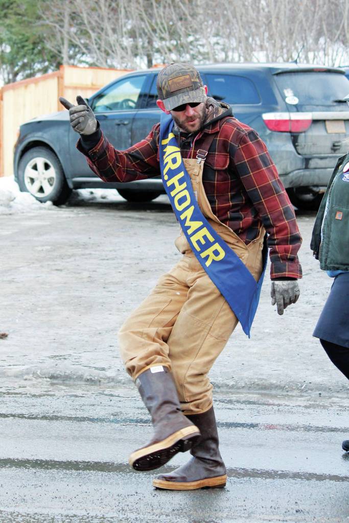 Jim Maloney, this years winner of the Mr. Homer Contest, marches down Pioneer Avenue in this years Homer Winter Carnival Parade on Saturday, Feb. 8, 2020 in Homer, Alaska. (Photo by Megan Pacer/Homer News)