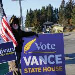 Raymond Walker holds a sign on Tuesday, Nov. 3, 2020, for his daughter, Sarah Vance, on Pioneer Avenue in Homer, Alaska. (Photo by Michael Armstrong/Homer News)