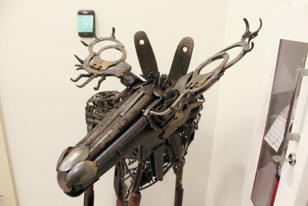 This Don Henry original sculpture, seen in the new Homer Police Station on Thursday, Sept. 24, 2020 in Homer, Alaska, was built using parts of seized firearms and knives, as well as handcuffs that were damaged by people that didnt want them on, according to Homer Police Chief Mark Robl. (Photo by Megan Pacer/Homer News)