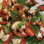 Warm chili shrimp salad with little gems and tomatoes makes a festive holiday dish with its Christmas red-and-green colors, as seen here on Tuesday, Dec. 22, 2020, in the kitchen of her Homer, Alaska, home. (Photo by Teri Robl)