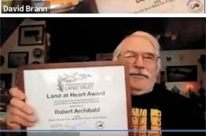 From top to bottom: Bill Hague, Dave Brann and Robert Archibald hold up their Land at Heart awards during a ceremony held via Zoom by Kachemak Heritage Land Trust. (Photo courtesy Blake Gebhardt)